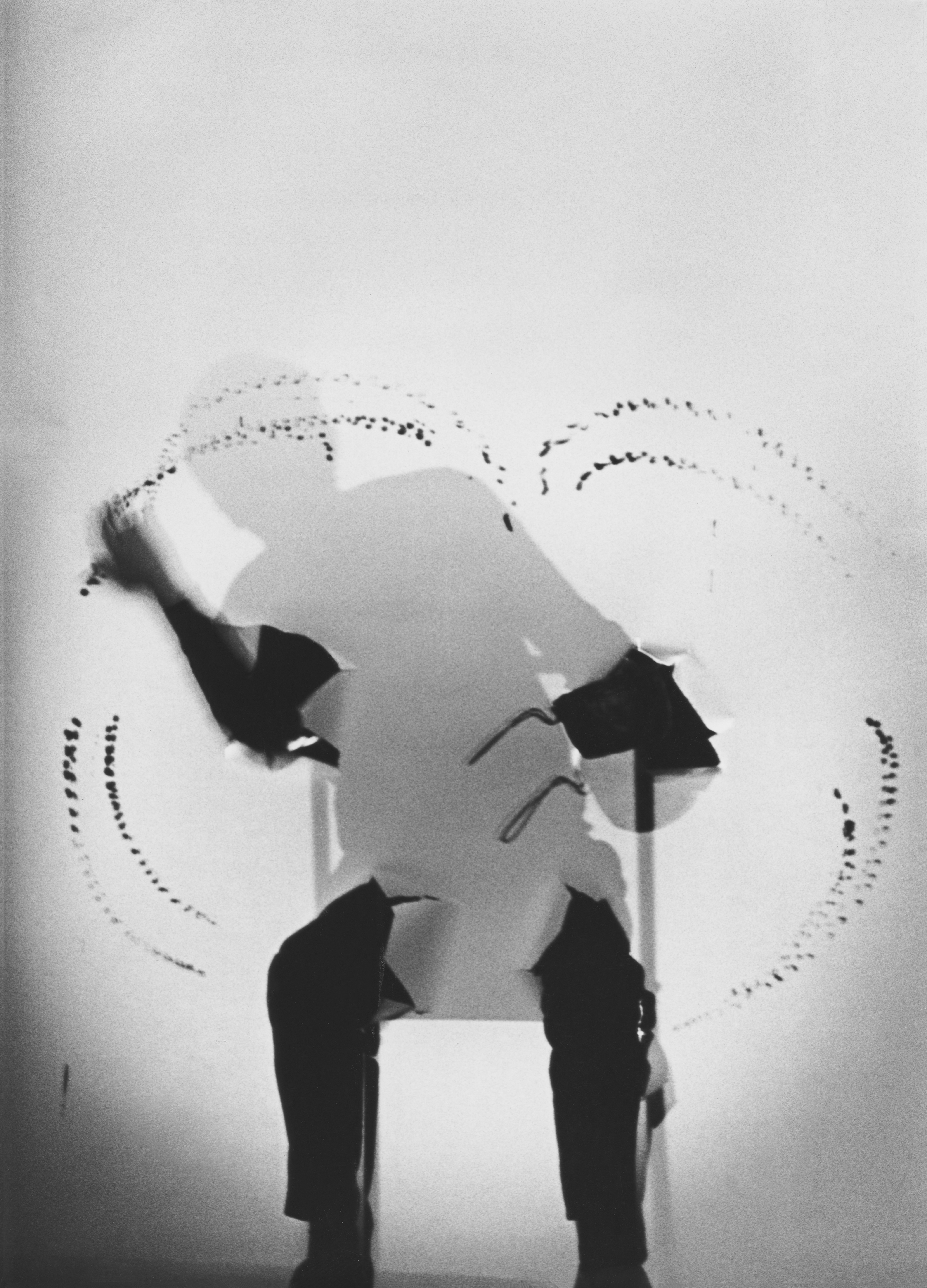  Black and white image of a silhouette sitting on a chair
