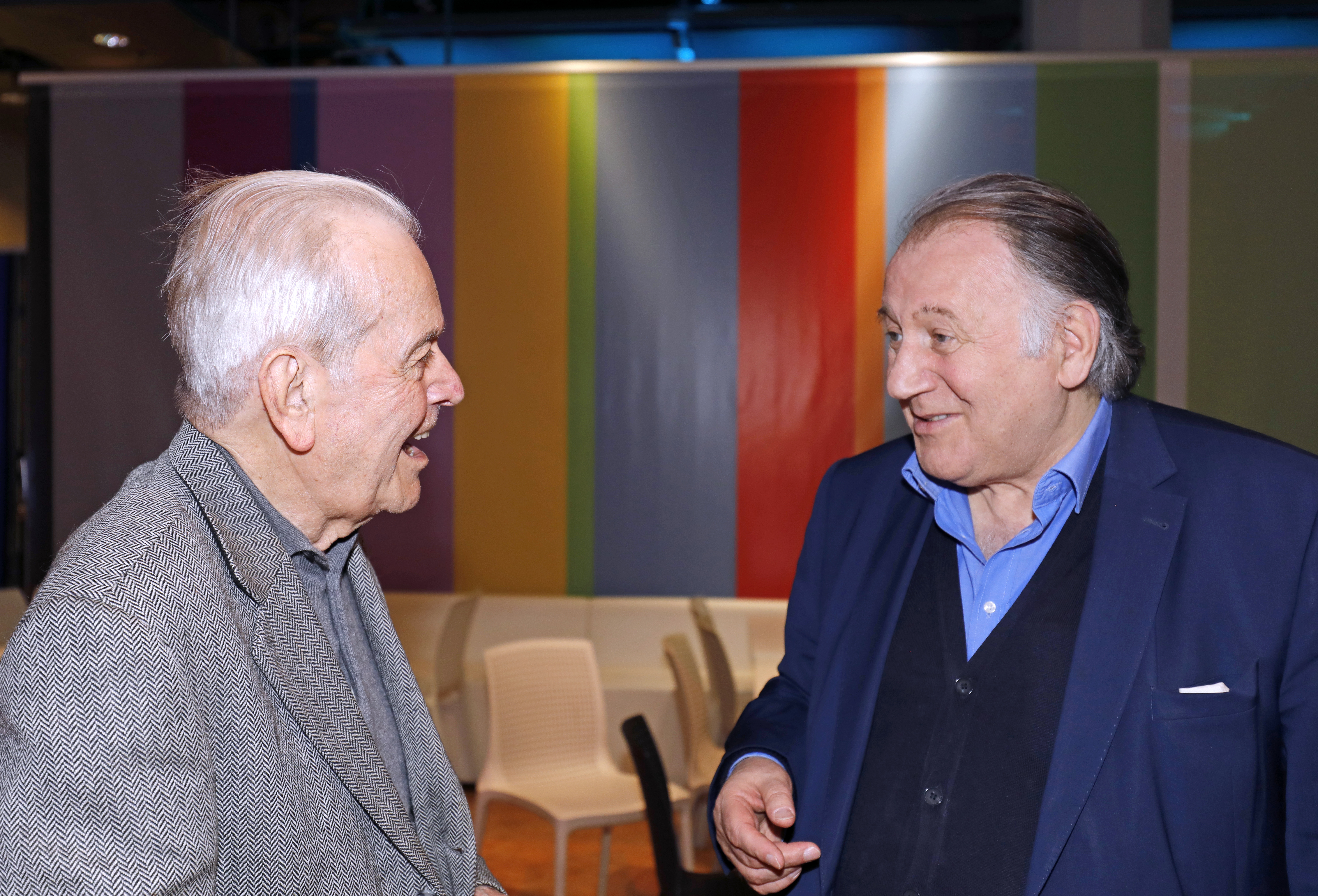 Two men are having a conversation.