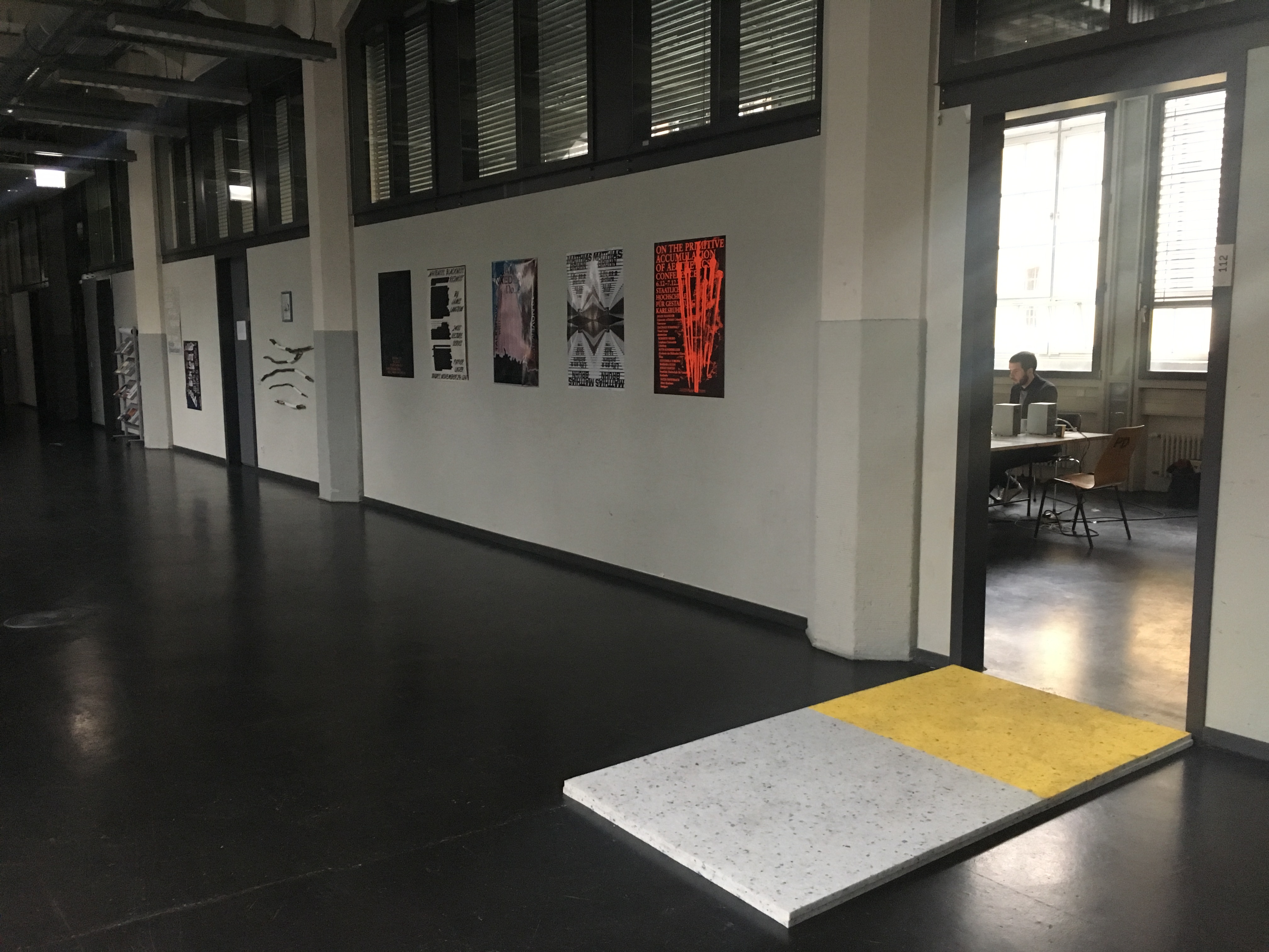 In front of the entrance to the seminar room of the Critical Zones Study Group at Karlsruhe University of Arts and Design (HfG) there is a foam folder on the floor as a test for all seminar participants.