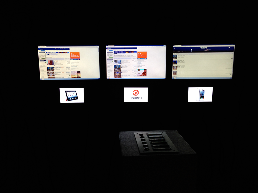 Three screens are showing diverse operating systems
