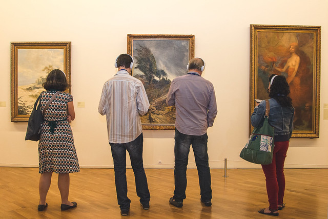 Museum visitors use the chatbot "Voice of Art" in the Pincaoteca de Sao Paulo 