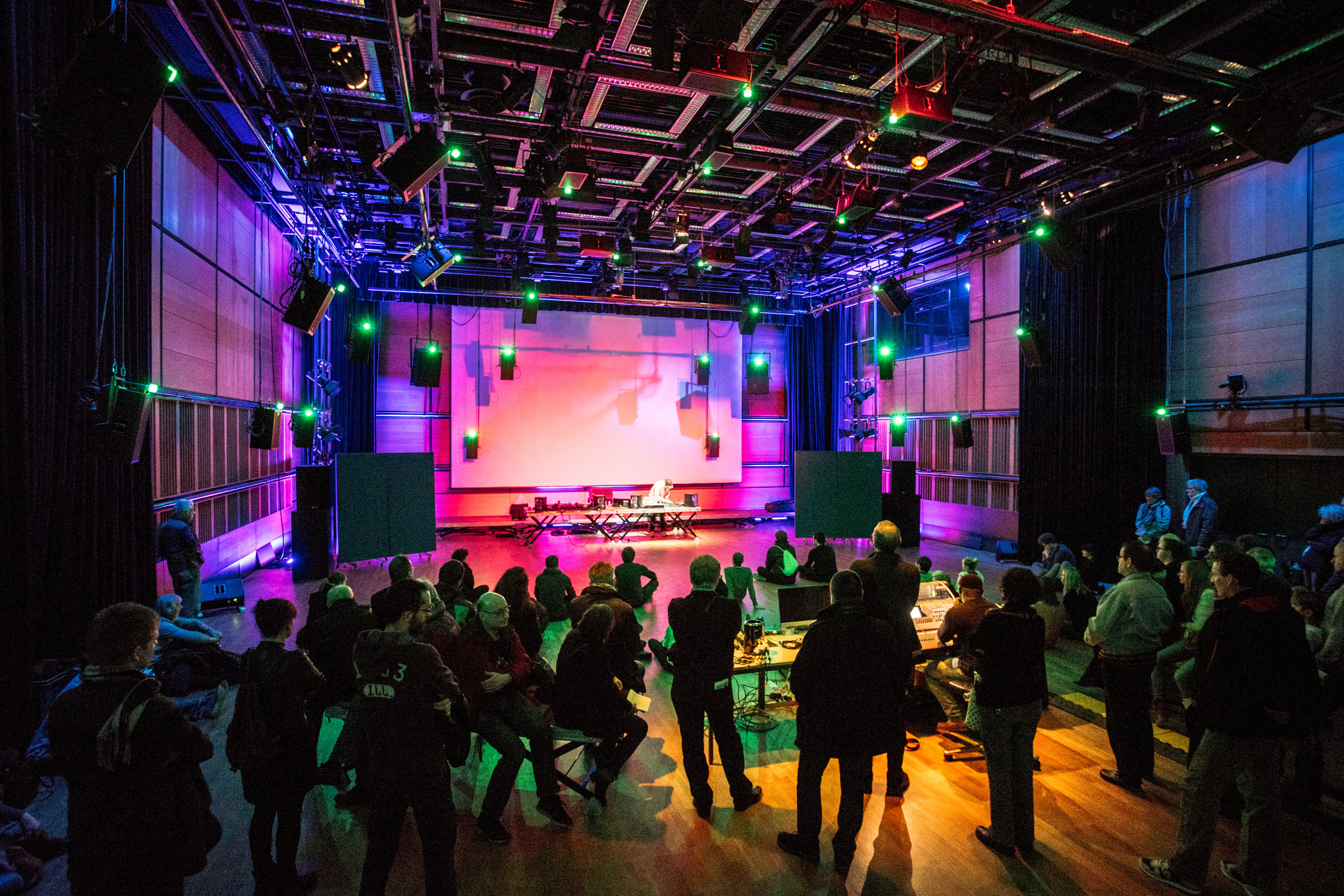 A concert inside the ZKM Klangdom with atmospheric lights.