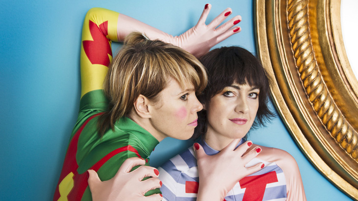 Two woman in colored costumes