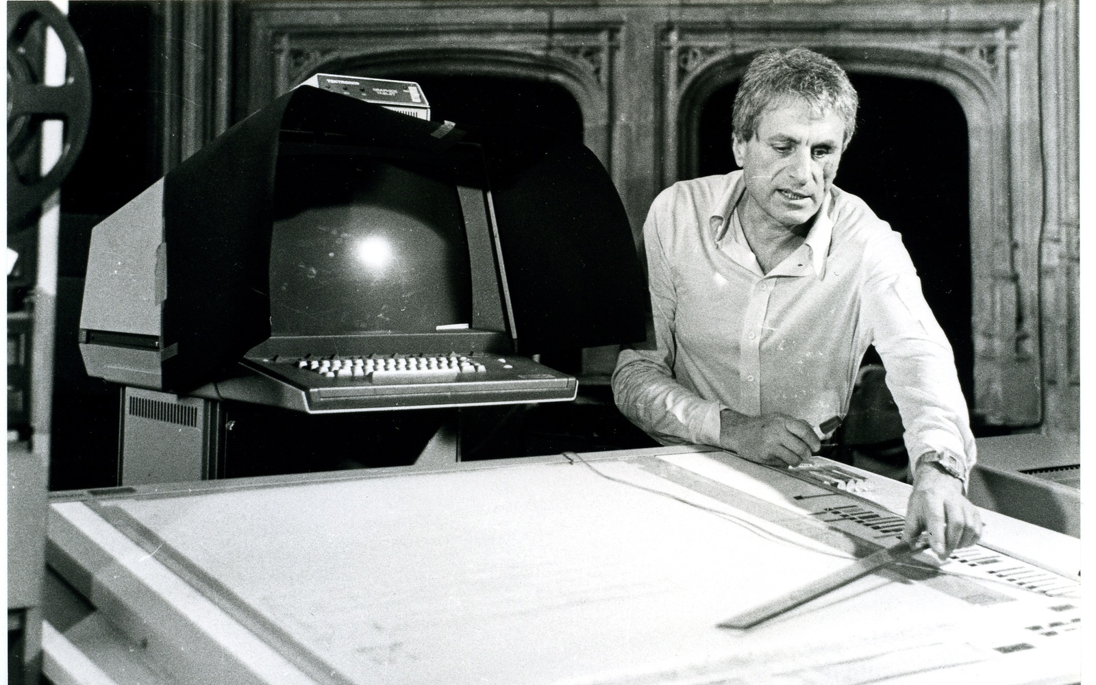 A man works on a computer program that digitally translates the graphic notation into sound