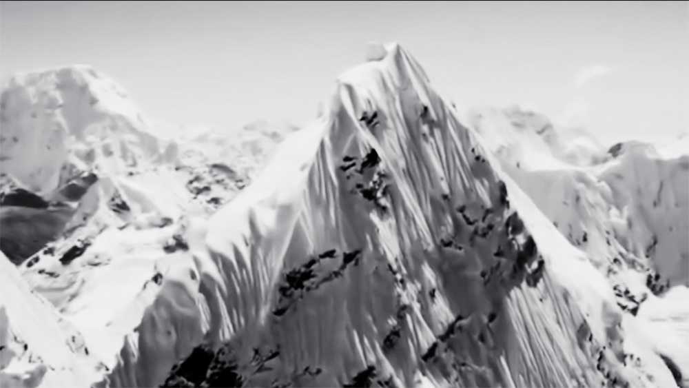 A snow-covered mountain range. Excerpt from the film "Nature" by Artavazd Pelechian