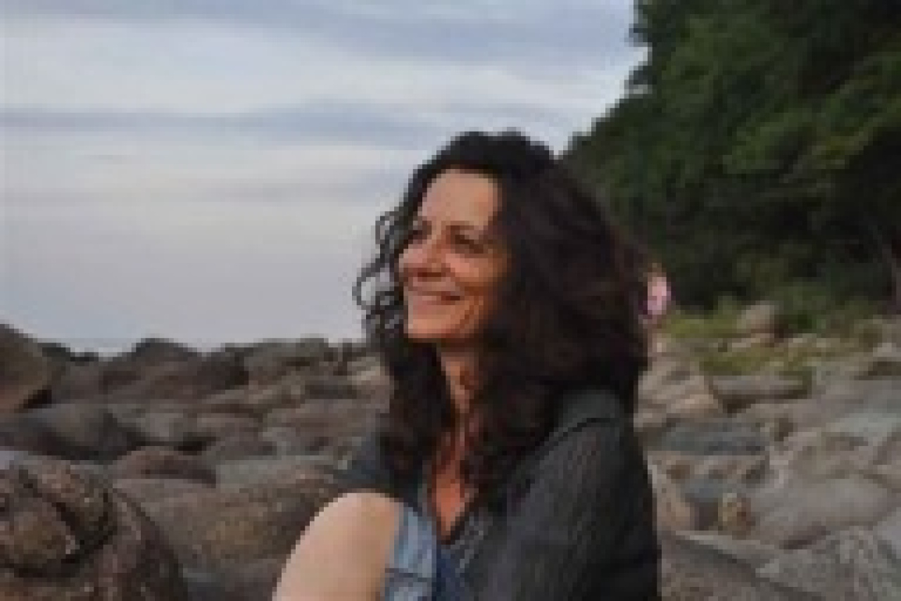A woman sitting at the beach