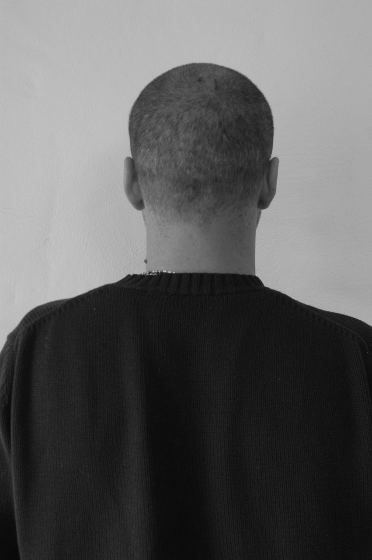 Black and white image of the back of a head
