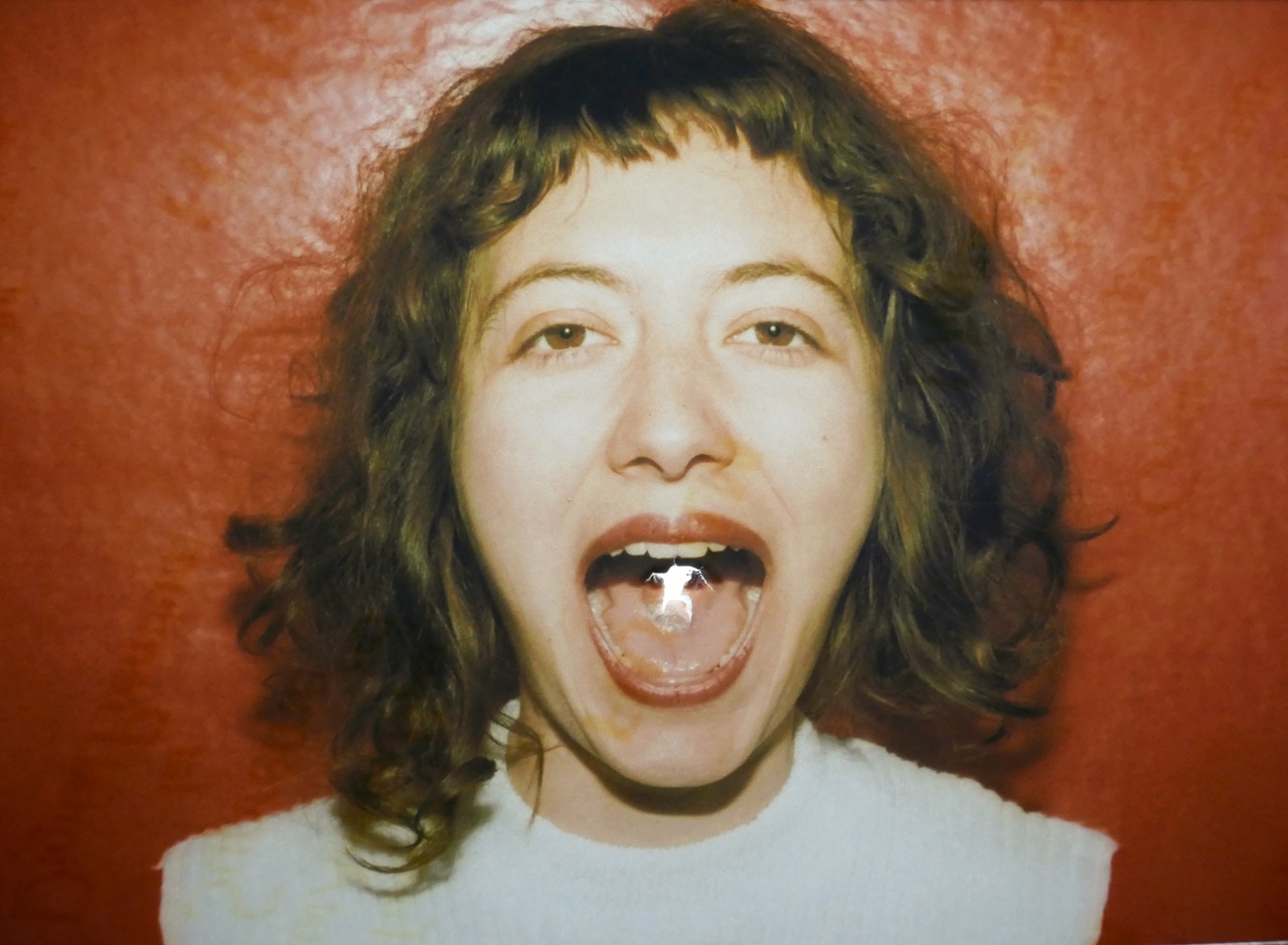 The face of a person with an open mouth can be seen. 
