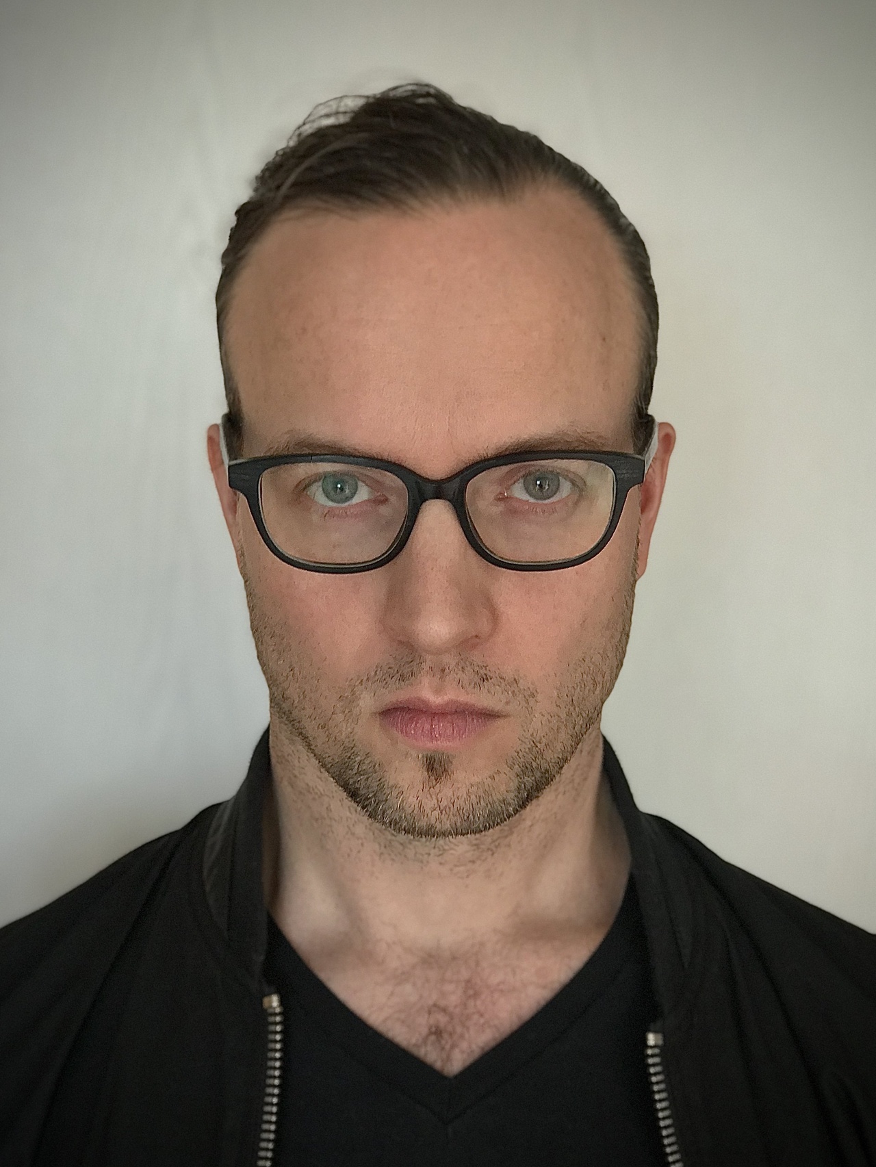 A portrait photo of Moritz Lobeck is shown. 