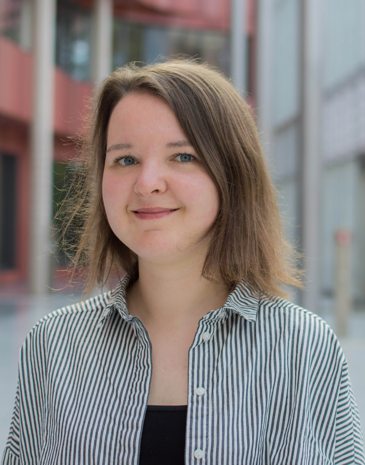 A portrait photo of a person is shown. 
