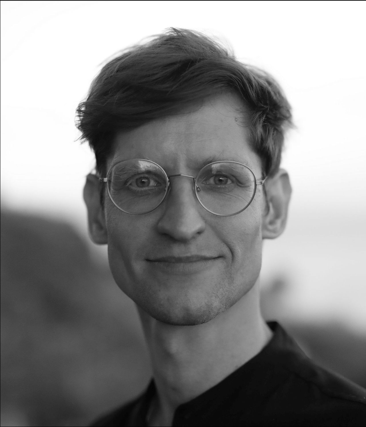 A black and white portrait photo of a person.