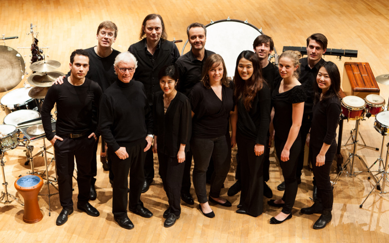 Several persons look to the camera