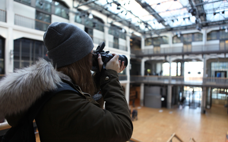 Students documenting the GLOBALE. Student is filming the ZKM. 