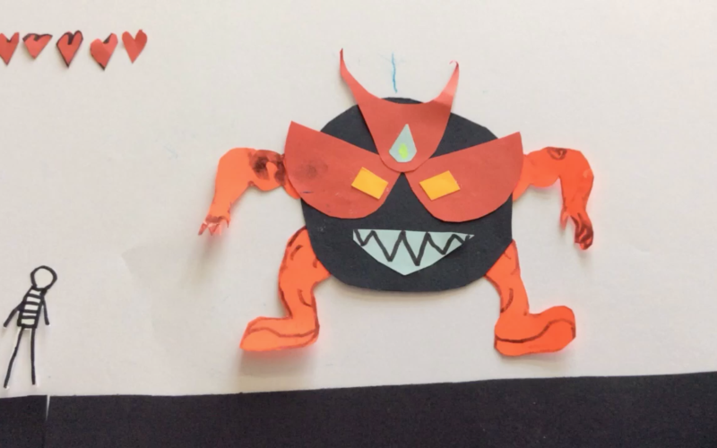 Standbild eines Trickfilms bei dem ein großes Monsterwesen einem kleinen Strichmännchen gegenüber steht.