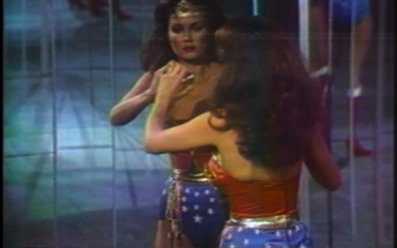 The Super Heroine Wonder Woman looks at herself for the first time in the mirror after her transformation.