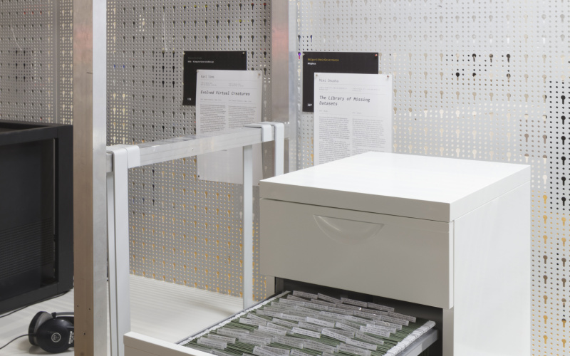A small white cupboard with file drawer