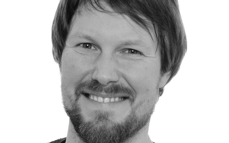 Portrait of Adrain Hermann in black and white