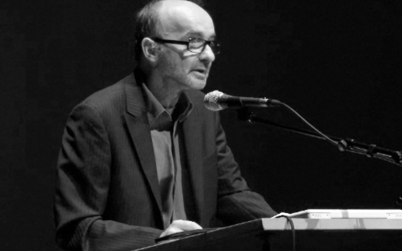 Christoph Blase at the lectern with microphone