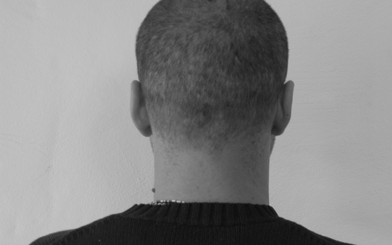 Black and white image of the back of a head