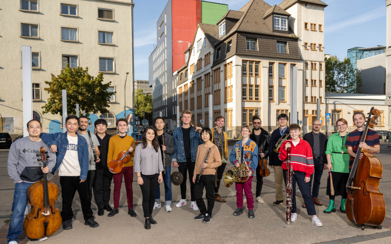 You can see a group of people with various musical instruments.