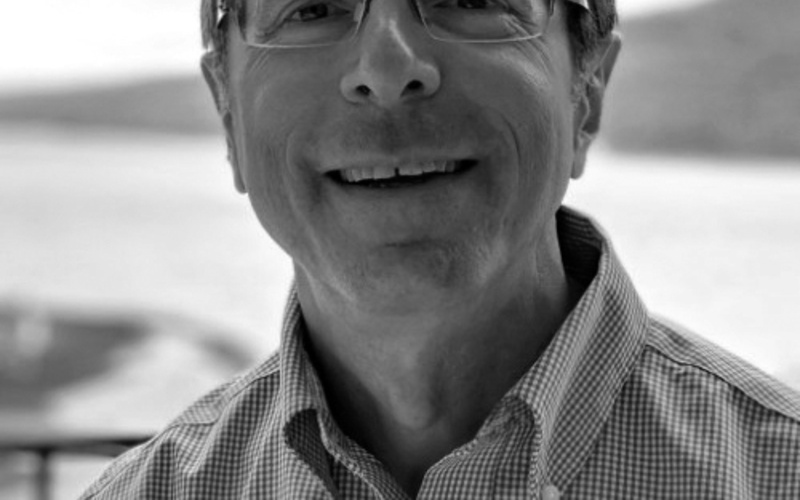 A portrait photo of Gary Oberbrunner is shown. 