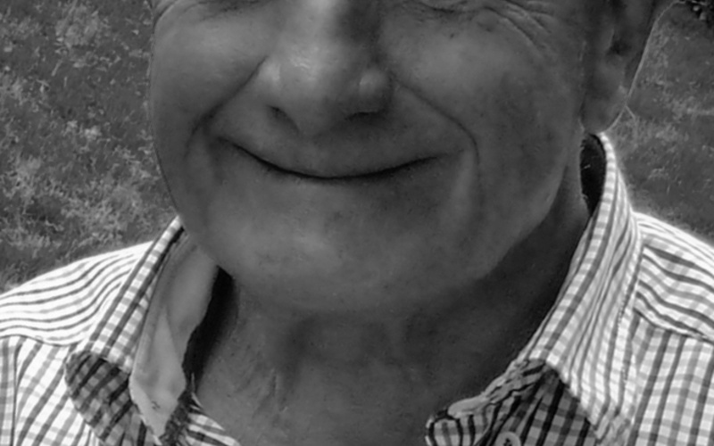 A portrait photo of Klaus Schilling is shown. 