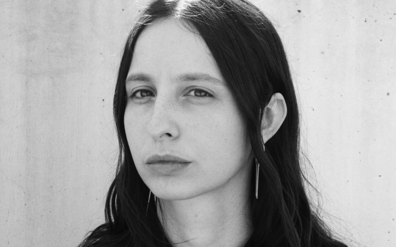 A black and white portrait photo of a person is shown.