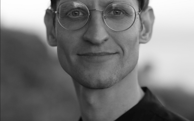 A black and white portrait photo of a person.