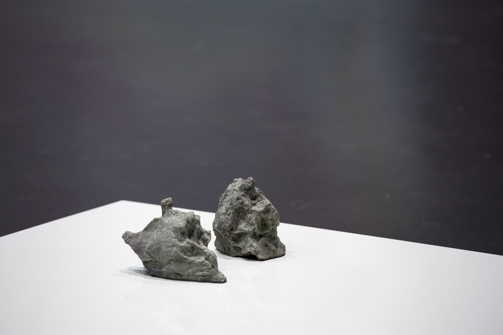 Two stones lay on a white plate
