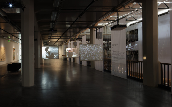 View into the exhibition »Beat Generation«: large-format video projections and (hand)writings