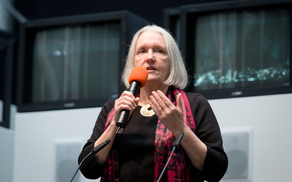 A woman talking into a microphone