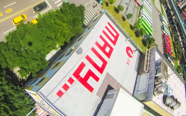 The word "many" in red letters on a roof