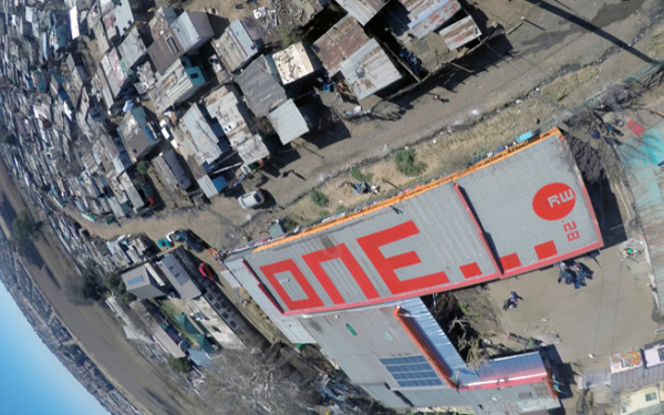 The word "one" in red letters on a roof