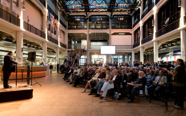 People sitting on chairs in the ZKM_Foyer