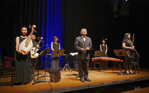 A four-piece orchestra with a conductor