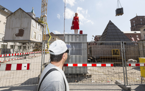 A woman standing in the middle of a construction site
