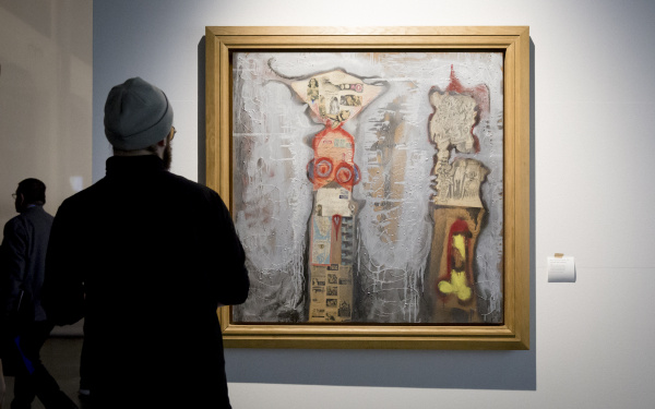 A man looks at a conceptional painting