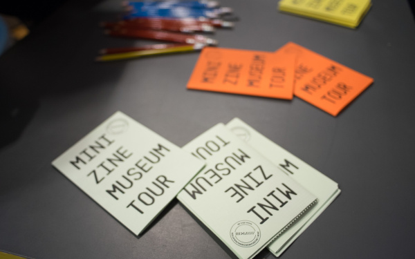 White an orange hand outs on which "mini tour" stands