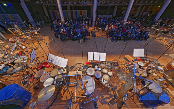 People sitting in front of diverse percussions