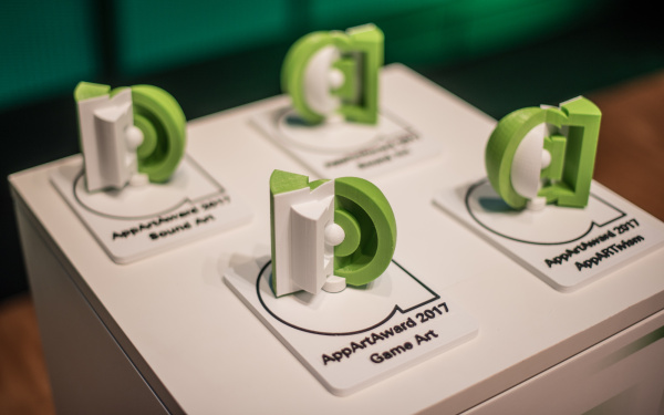 Four green trophies 