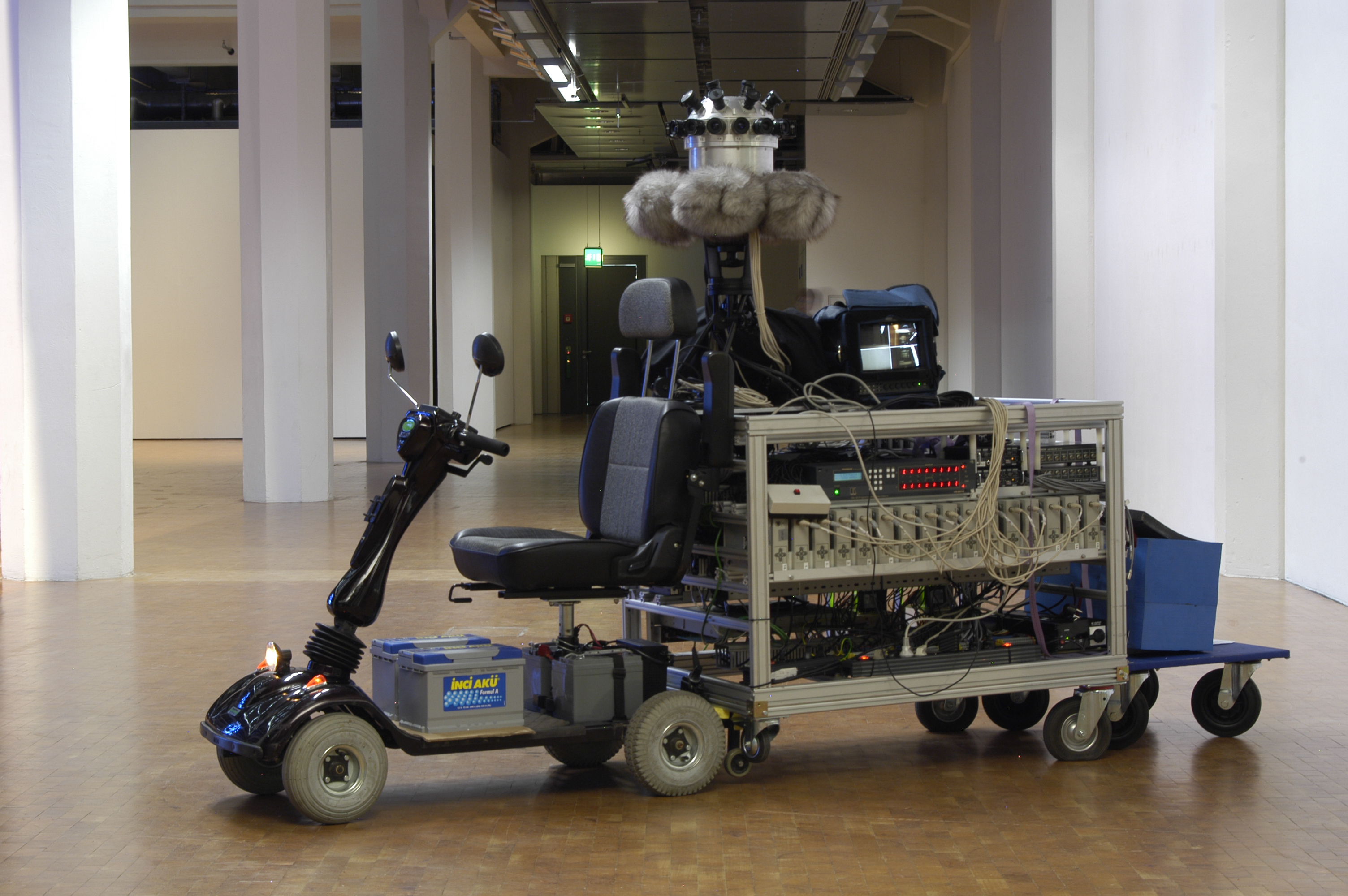 scooter with a camera and further technical appliances on top