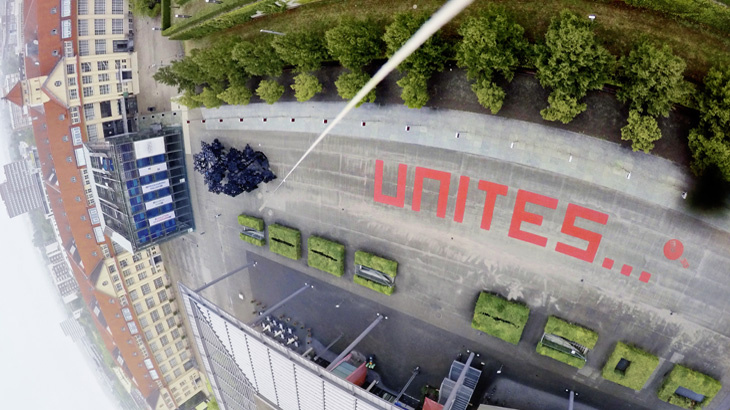 The word "unites" in red letters on the ZKM_Forecourt