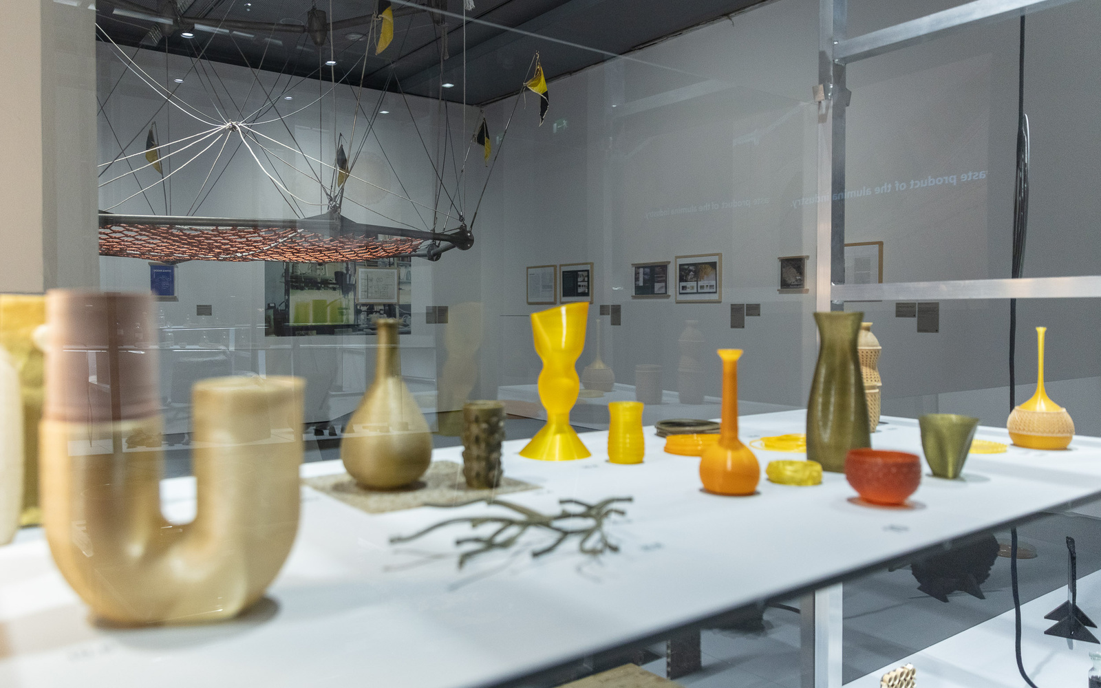 You can see several vase-shaped objects on a table.