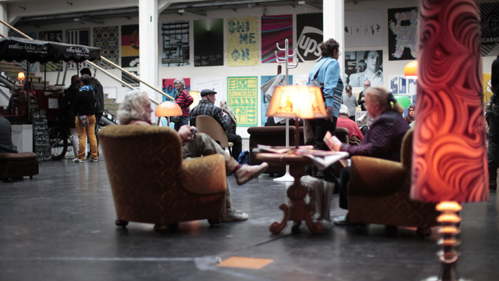 People are sitting on seating furniture
