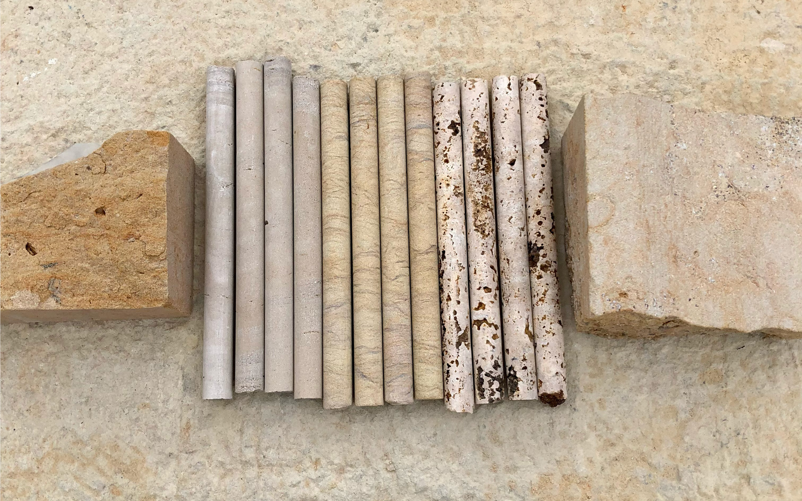 You can see several wooden sticks and two wooden blocks. 