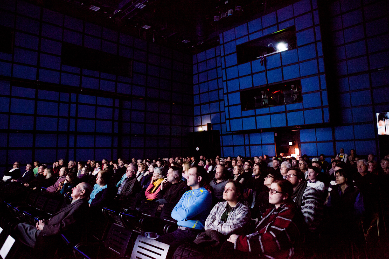 On view is an audience in the media theater.