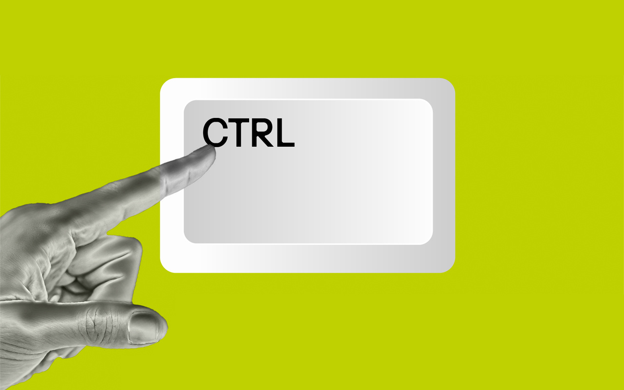 The image shows a silver hand pointing to the letters “CTRL.”