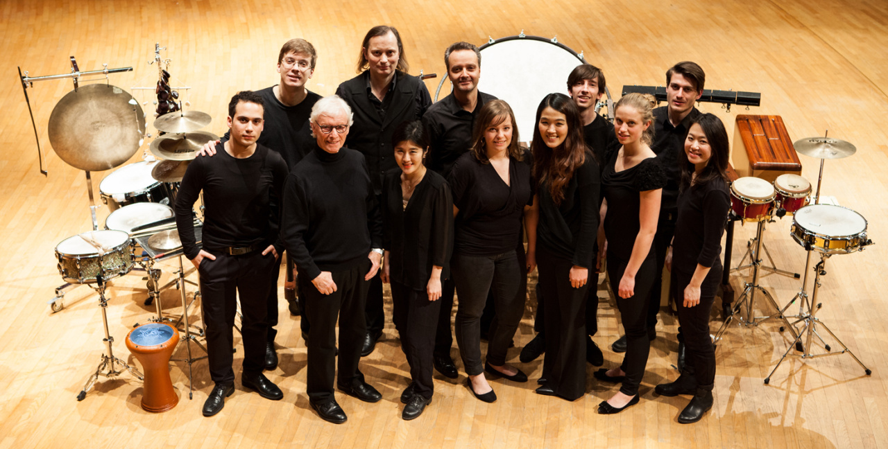 Several persons look to the camera