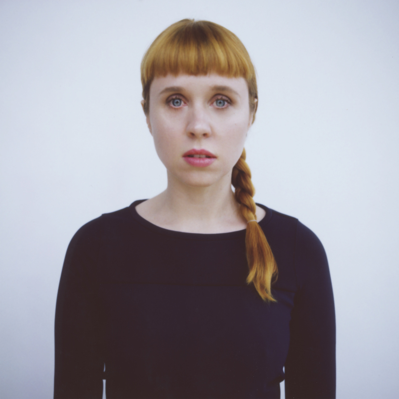 Portrait of a woman with long, braided hair