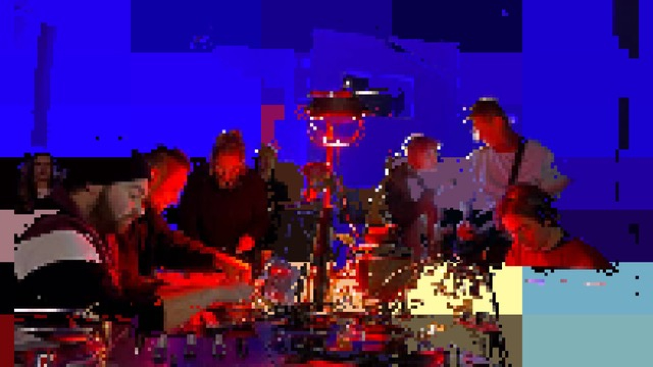 Graphically distorted image of the studio members